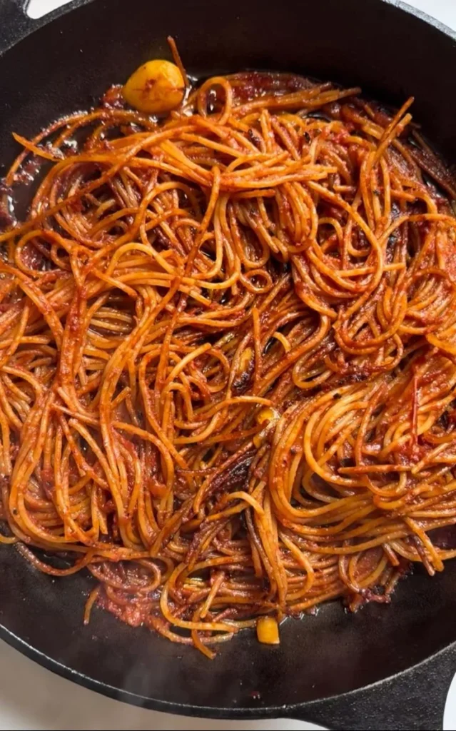 Assassin’s Pasta dish featuring a rich tomato sauce and fresh herbs