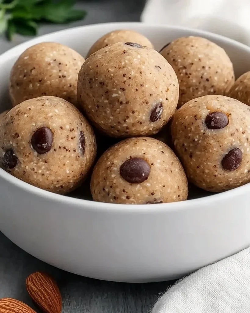 Delicious almond flour protein balls stacked on a wooden board