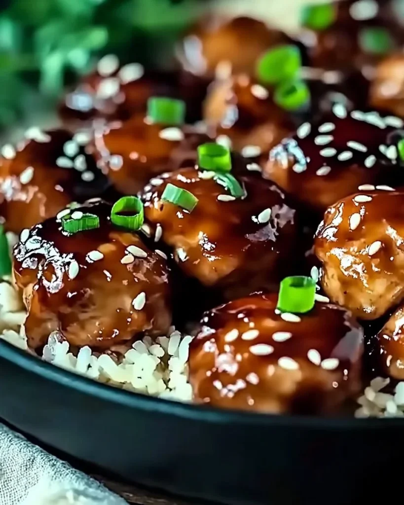 Succulent Honey Garlic Chicken garnished with green onions on a plate