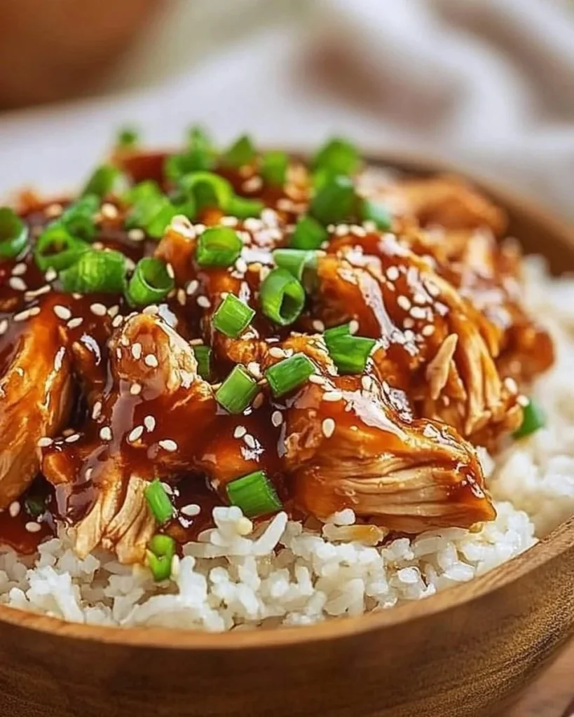 Delicious Asian Crock Pot Teriyaki Chicken served with vegetables and rice