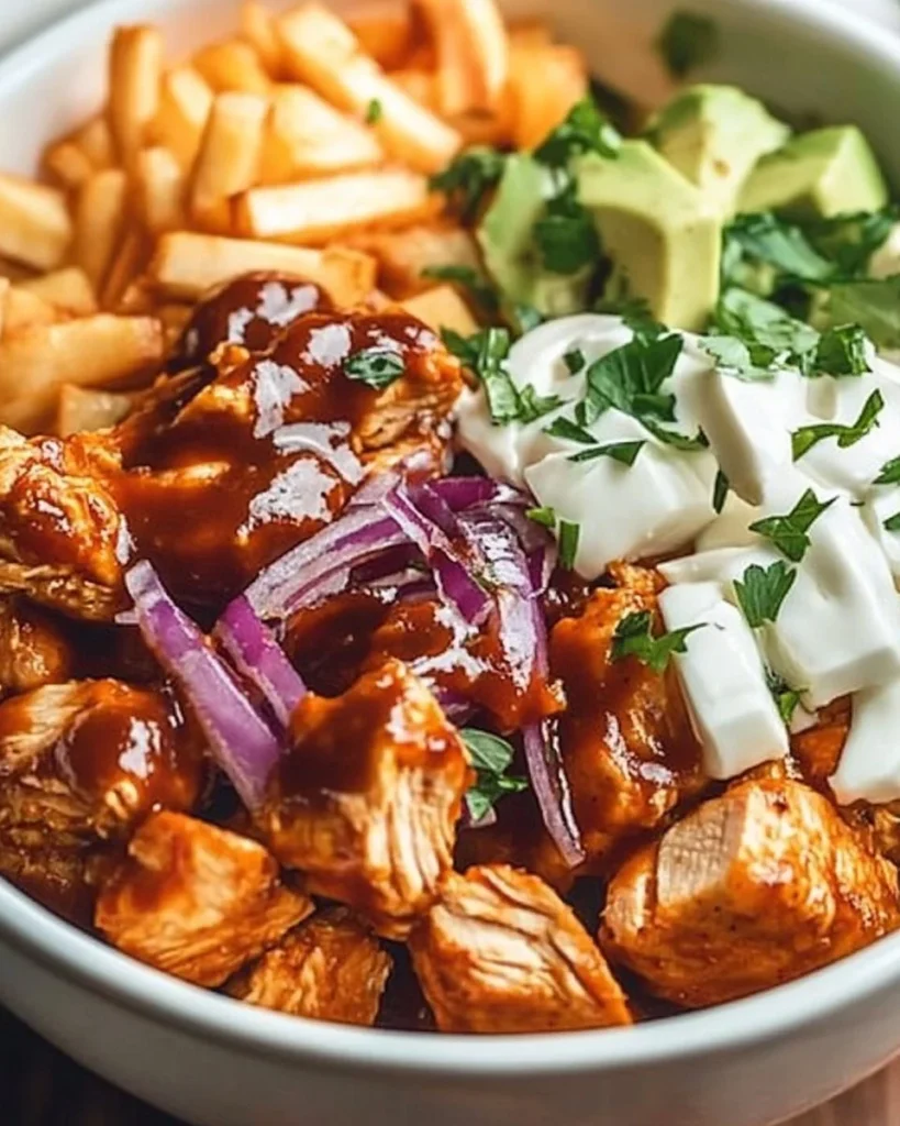 Delicious BBQ chicken bowl with fresh vegetables and toppings