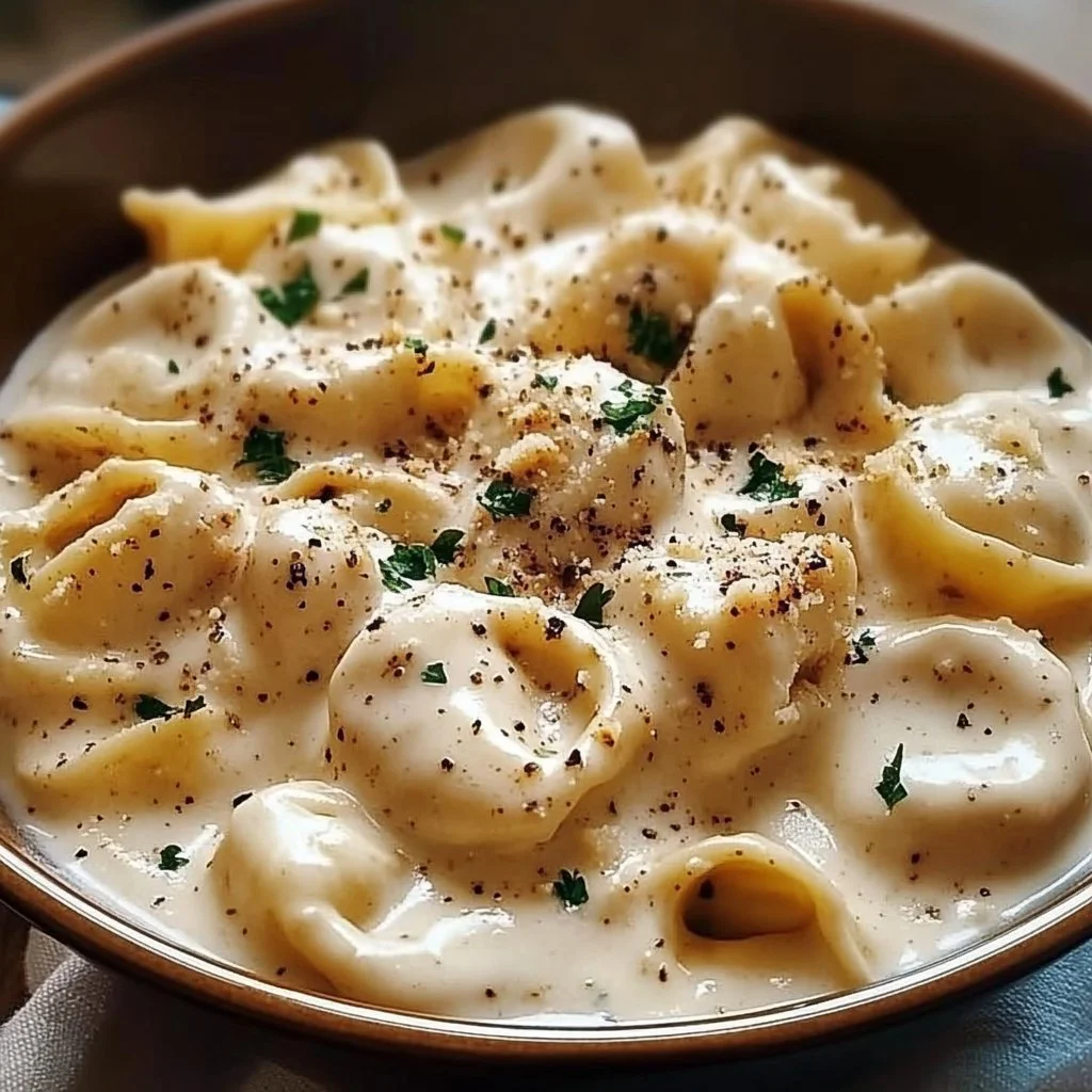 Creamy Crockpot Chicken Alfredo Tortellini served in a bowl