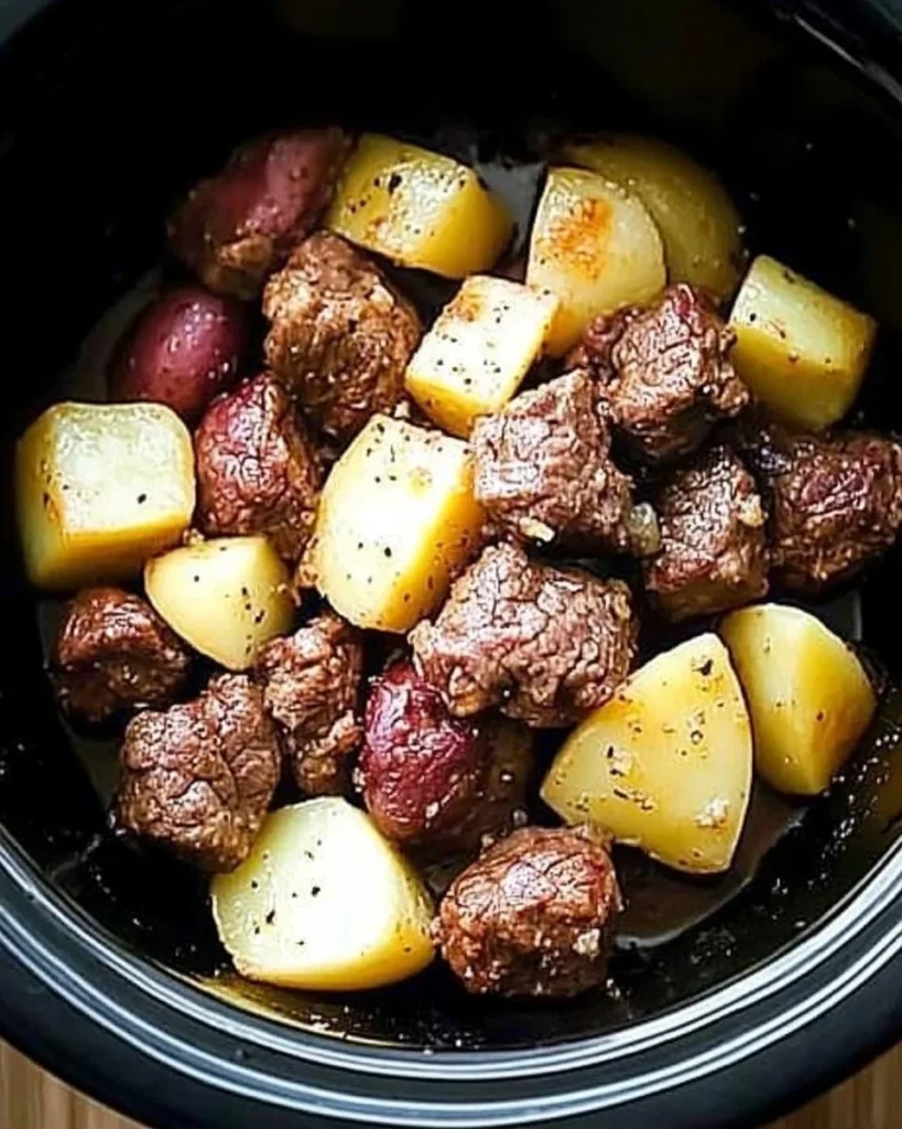 Crockpot garlic butter beef bites served with tender potatoes