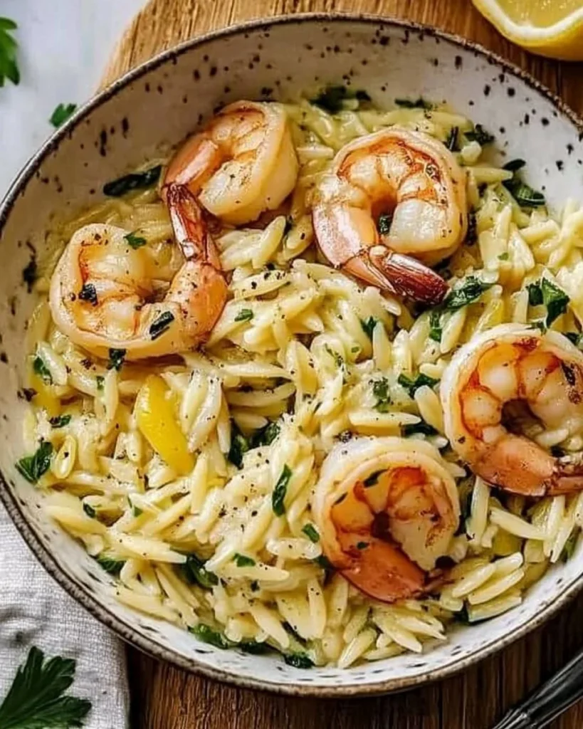 Delicious Lemon Garlic Shrimp served over creamy orzo pasta.