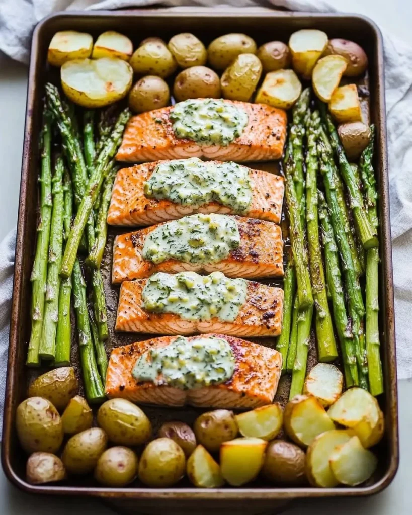 Sheet pan garlic butter salmon with roasted potatoes and asparagus ready to serve.