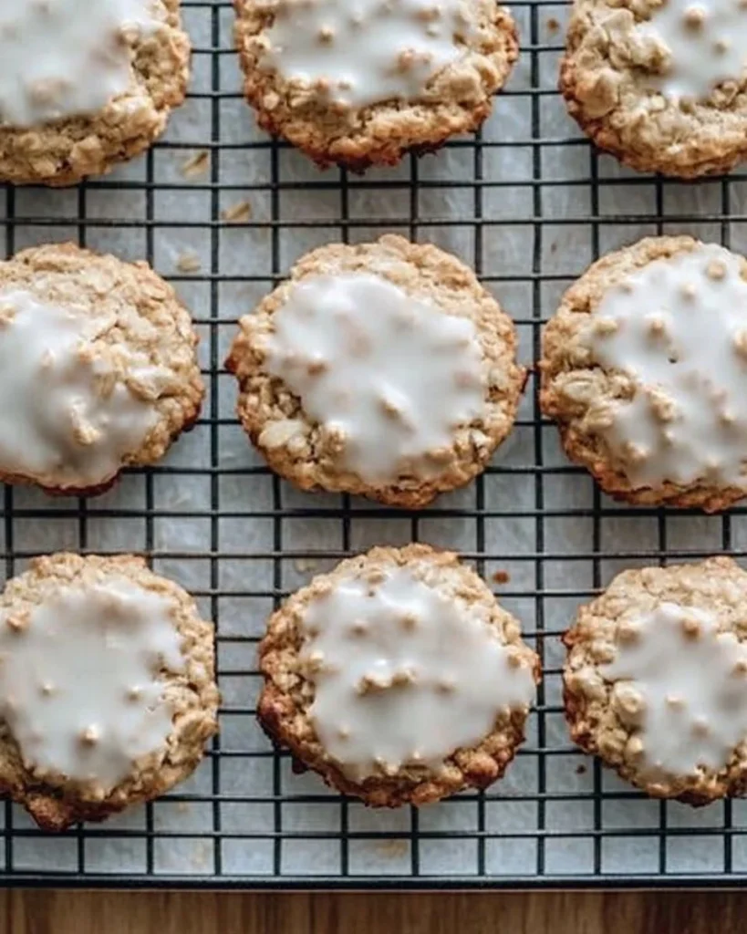Freshly baked soft and chewy oatmeal cookies on a cooling rack