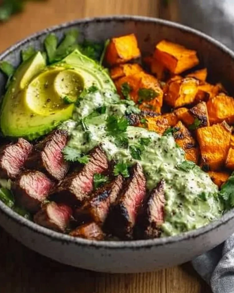 Healthy steak and sweet potato bowl with vibrant vegetables