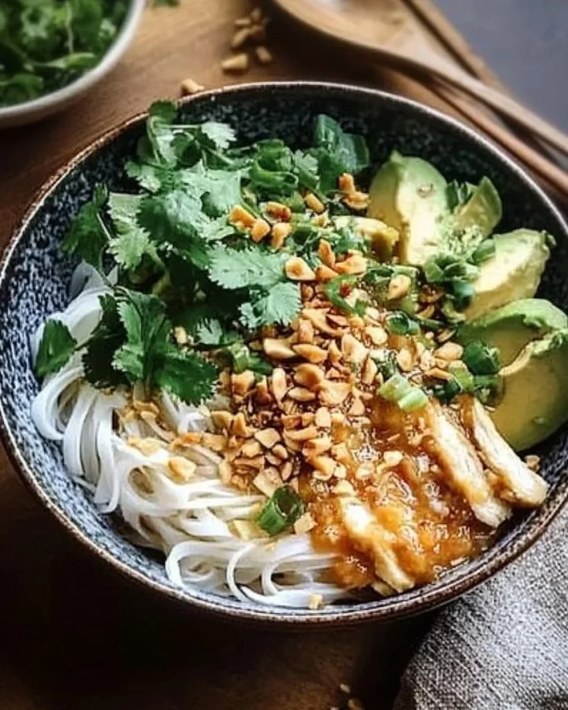 Thai Peanut Chicken Noodle Bowls with fresh vegetables and peanuts